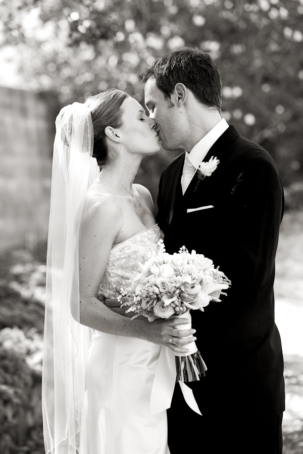 black and white photo of the happy couple kissing - photo by San Francisco based wedding photographer Lisa Lefkowitz